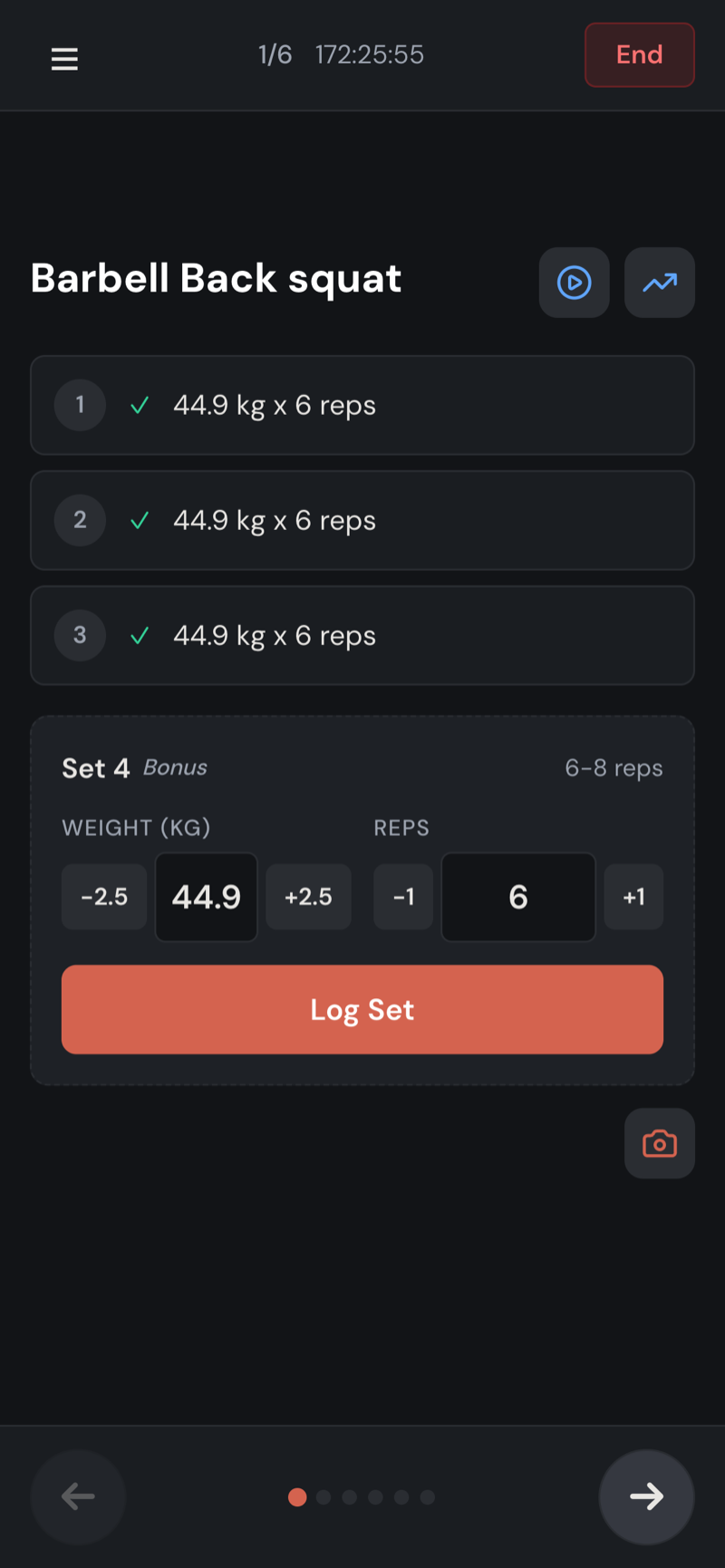Dark-themed workout logging screen showing set-by-set tracking with weight and rep controls